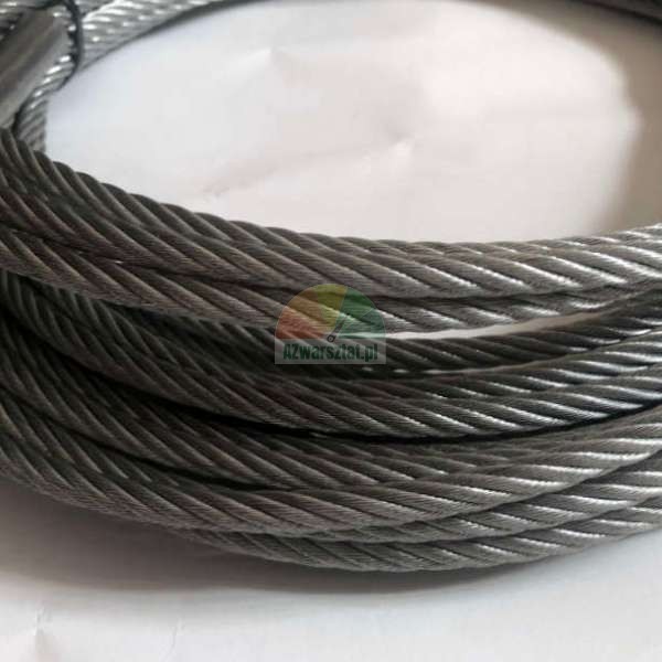 Coiled steel wire rope, showing the twisted strand structure against a light background.