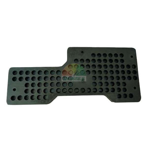Dark, perforated, irregularly shaped mounting plate or mat made of plastic, covered with symmetrical rows of circular holes.