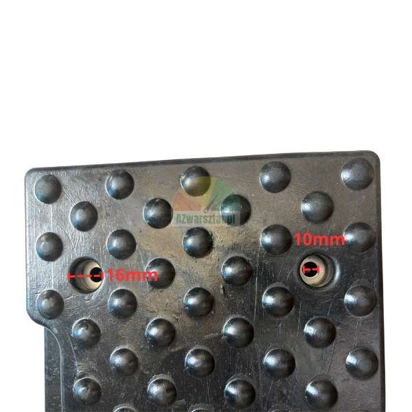 Close-up of a black textured surface (rubber mat/pad) with studded bumps, showing two mounting holes measured at 16mm and 10mm.