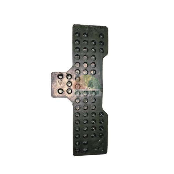 Black rubber pad with numerous circular depressions, an anti-slip mat element or pedal cover.
