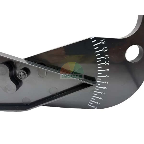 Detail of a black measuring tool or protractor showing a numerical scale from 2 to 13 and a visible pivot mechanism