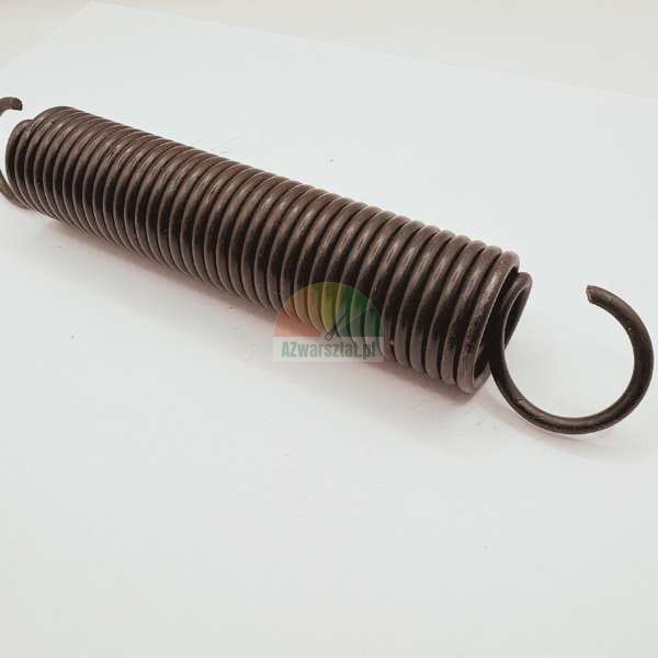 Durable black tension spring with hooks on both ends, lying on a light background.
