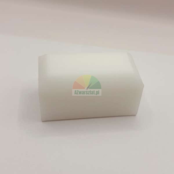 White plastic slide block with beveled edges.