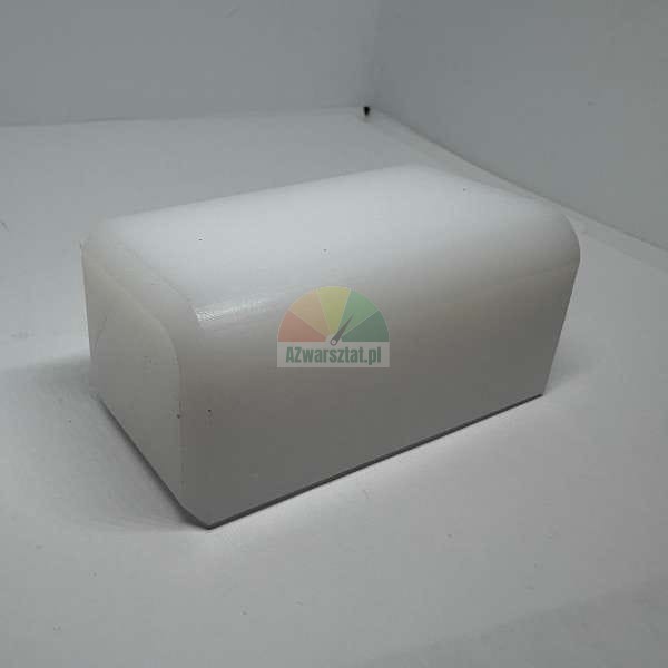 White rectangular plastic block with rounded edges on a white background