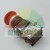 Industrial red emergency stop mushroom button with contact block assembly.