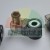 Solenoid valve coil DC 24V with DIN connector and cable gland on a gray background.