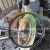 Metal motor hub and sealing ring on a workbench surrounded by tools.