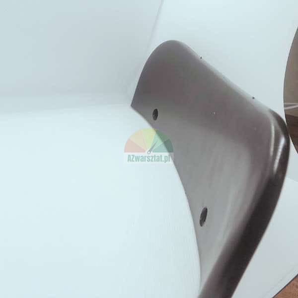 Close-up of a curved dark brown chair backrest on a white background