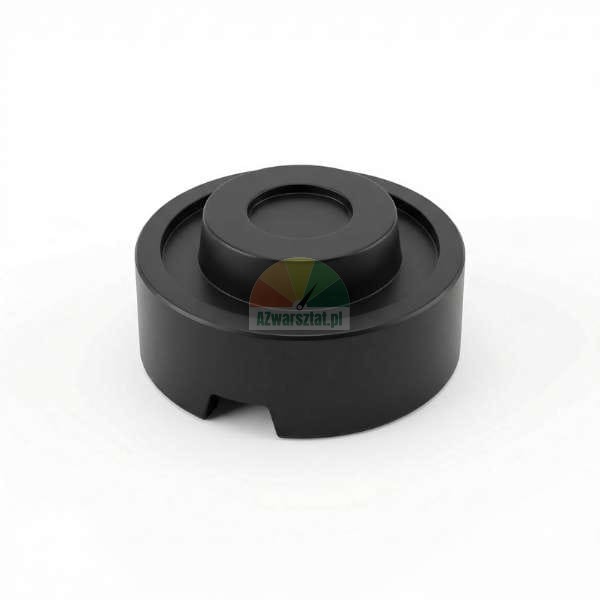 Black rubber jack pad adapter for car lift, circular shape with a central protrusion and a bottom notch.