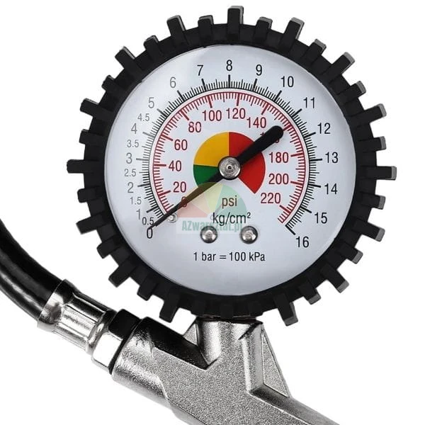 Analog tire pressure gauge with a black rubber protector and a white dial showing psi and bar units
