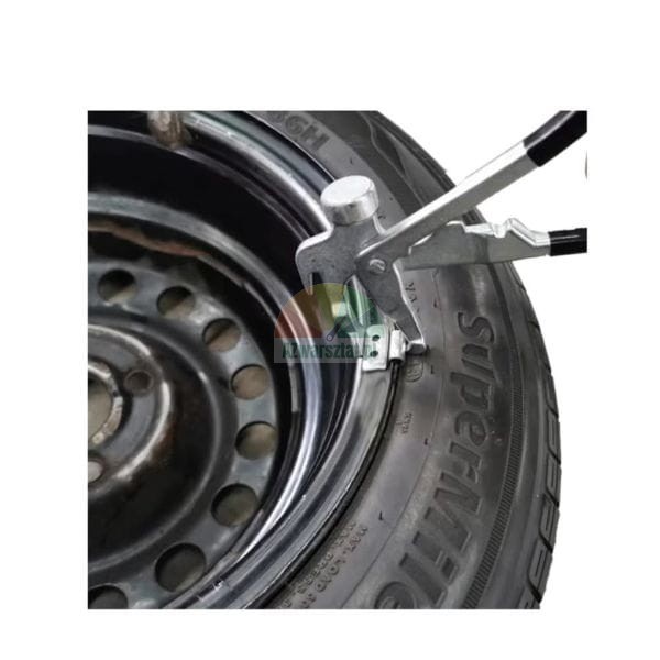Wheel weight pliers being used to attach a balancing weight to a steel car rim.
