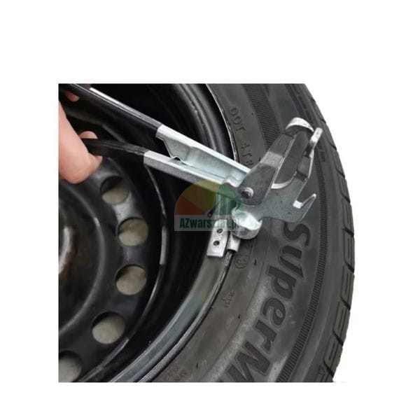 Wheel weight pliers being used on a car tire and rim.
