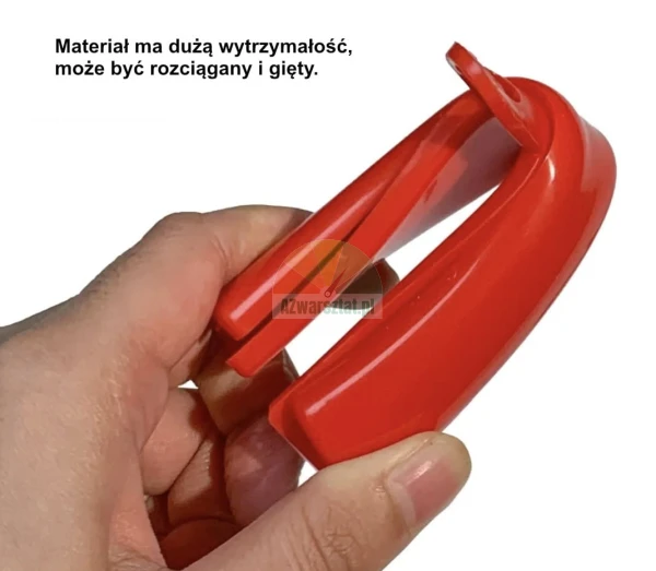 Red flexible plastic component being bent by hand, demonstrating the high durability of the material.