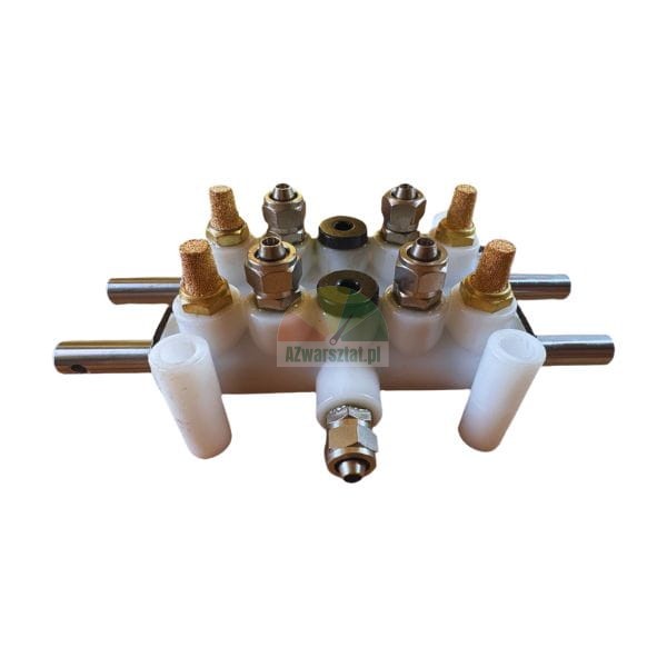 White pneumatic manifold block with brass silencers and steel connectors on a white background.