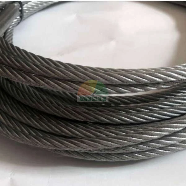 Strands of steel wire rope coiled in circles, close-up view of the metallic texture.