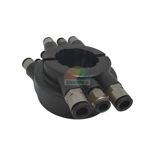 Black circular manifold with multiple push-in tube connectors on a white background.