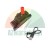 Black headlamp with open red charging port cover and USB cable