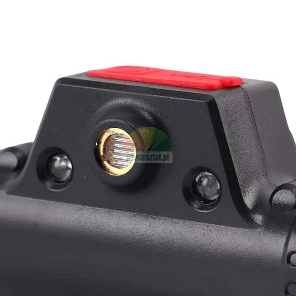Close-up of a black device sensor with a red cover on top and two small LEDs on the sides.