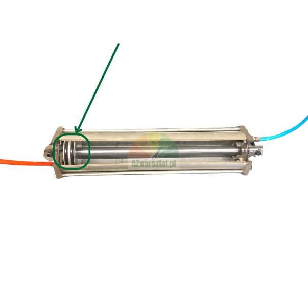 Cross-section of a pneumatic cylinder with a piston and rod, with a green circle and arrow pointing to the piston seal.