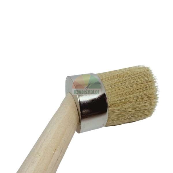 Close-up of a round paint brush with a wooden handle and light natural bristles