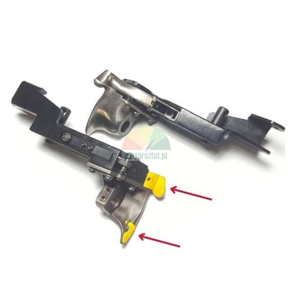Two metal trigger mechanisms on a white background, with red arrows pointing to yellow plastic tips.