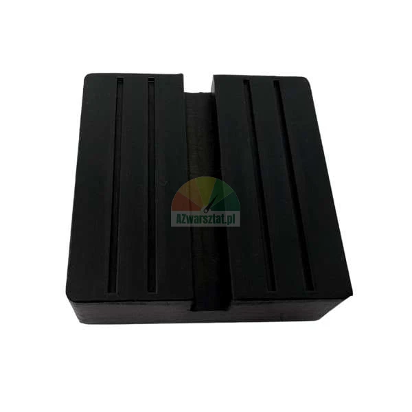 Black rubber jack pad with protective grooves for vehicle lifting.