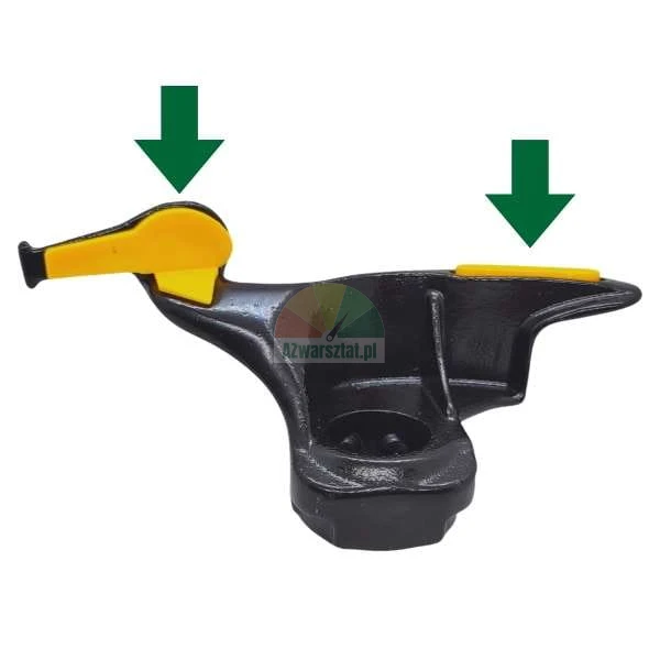 Tire changer mounting head with highlighted yellow plastic rim protectors indicated by green arrows.
