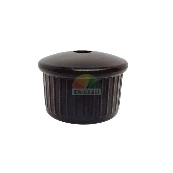 Black plastic ribbed tube plug with a rounded top and a central hole on a white background