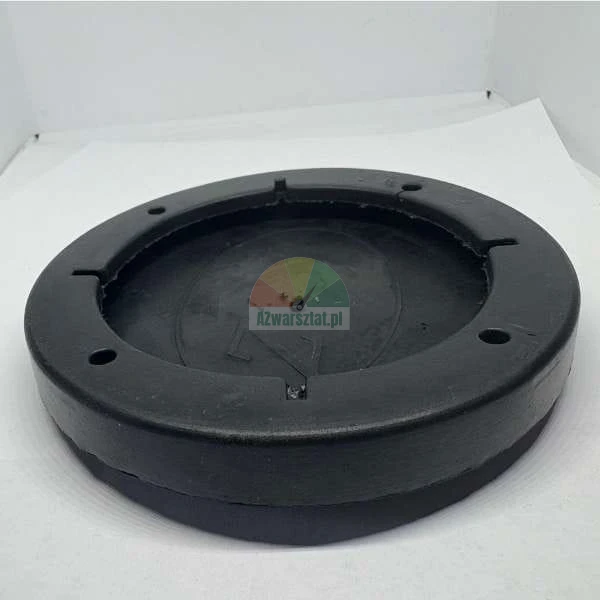Round black rubber jacking pad with recessed center and mounting holes.