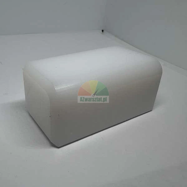 White rectangular block with rounded edges on a light background