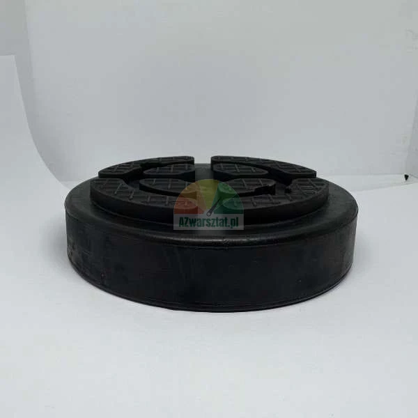 Black rubber jack pad for vehicle lifts with a textured grip surface.