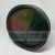 Black circular plastic base or cap with two holes and letter markings W and P.