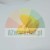 Yellow plastic mounting element with a rounded shape on a white background.