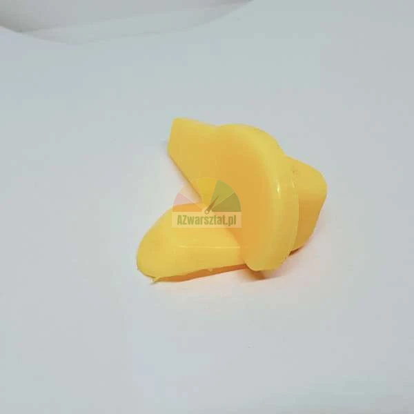 Yellow plastic mounting element with a rounded shape on a white background.