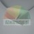 White U-shaped plastic edge protector on a gray background