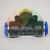Pneumatic push-in T-fitting with brass thread and blue release rings.