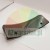 Black curved plastic part with two holes on a white background