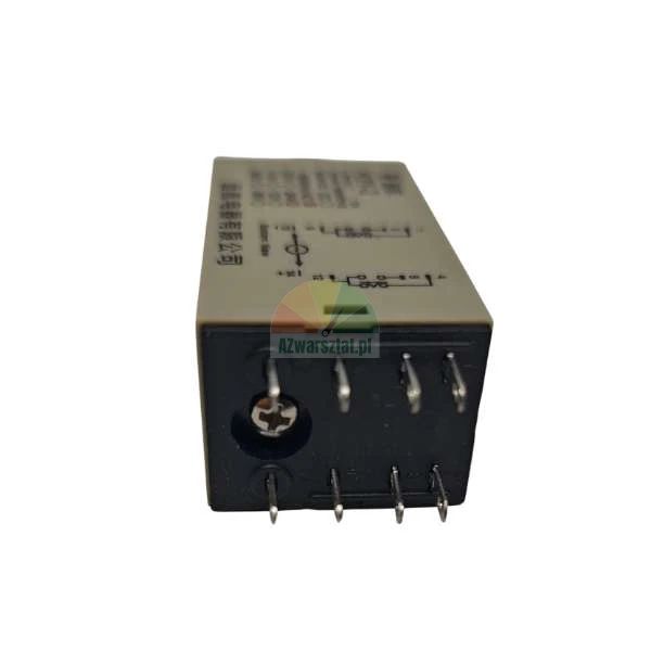 Industrial electromagnetic relay with pins and a technical diagram on the beige housing