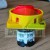 Rotary main switch with a red handle and yellow housing, emergency stop industrial switch.