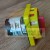 Industrial rotary isolator switch with a red handle and yellow housing showing electrical terminals.