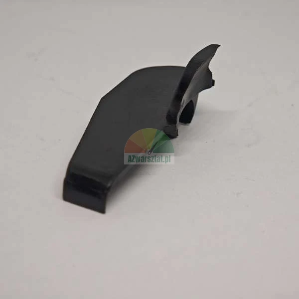 Black plastic trim element or cover for a vehicle on a light background.