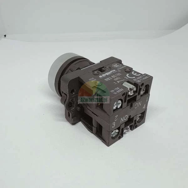 Industrial push button switch with contact block model NB2-BE102, showing NC and NO terminals and CE marking.