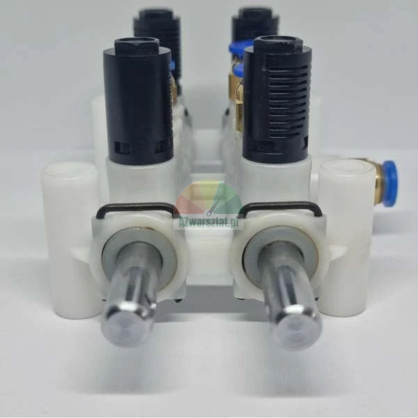 Front view of an LPG injector rail with a white body and black solenoid coils.