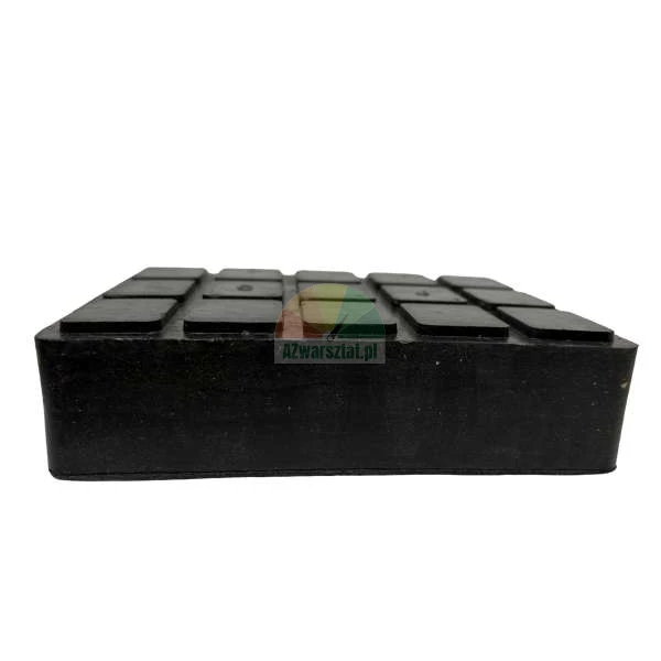 Black rubber jack pad with a non-slip grid texture on top.