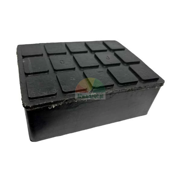 Black rubber jacking pad for a car lift with a non-slip square textured surface on top.