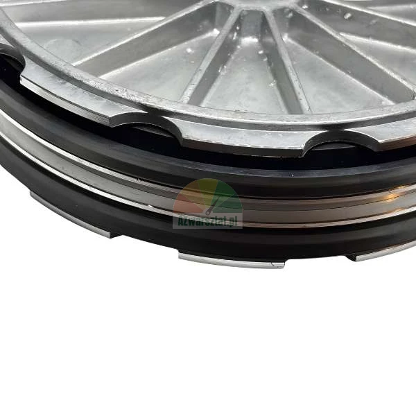 Close-up of a silver metal component with double black rubber seals