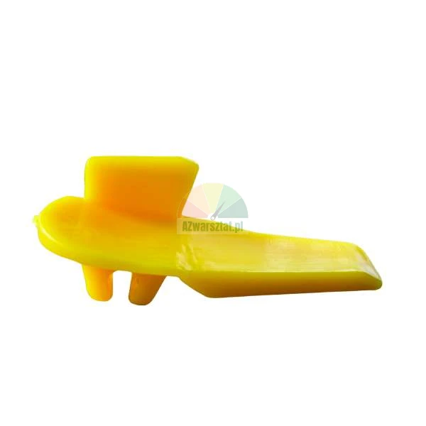 Yellow plastic mounting wedge or fastening element on a white background.
