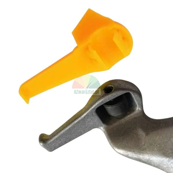 Orange plastic protective cover next to a metal tire changer demount head on a white background.