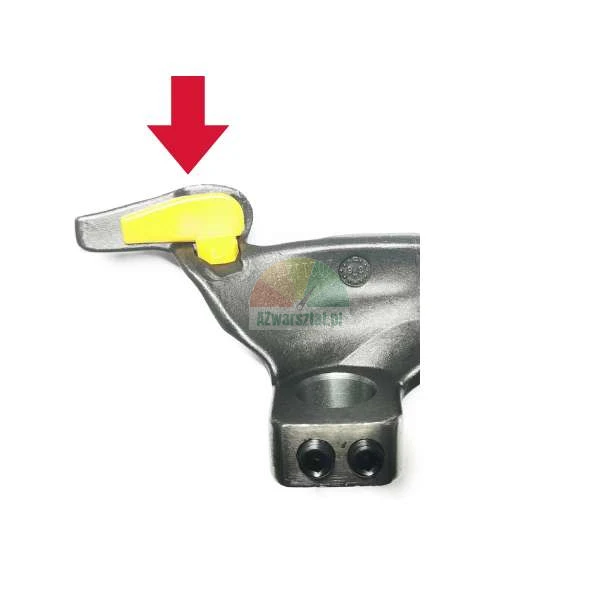 Metal tire changer mounting head with a yellow protective insert and a red arrow.