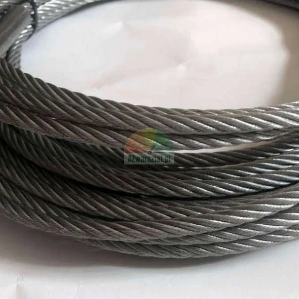 Coiled steel wire rope on a light background.